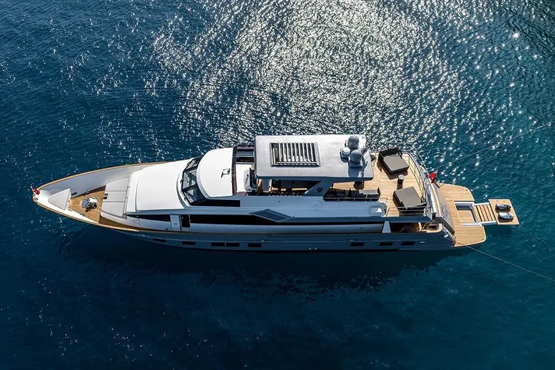  Yacht Photos Pics Aerial view of 1988 Heesen 32 yacht on sparkling blue water.