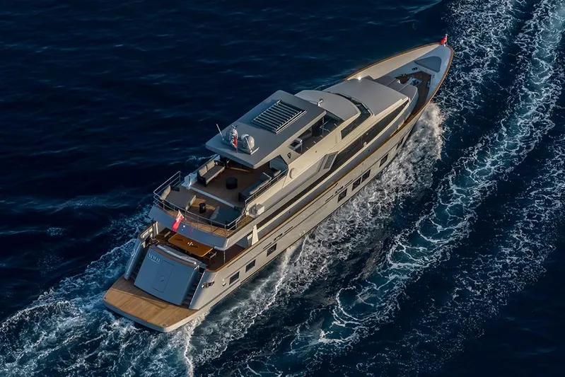  Yacht Photos Pics Aerial view of 1988 Heesen 32 yacht cruising on open sea.