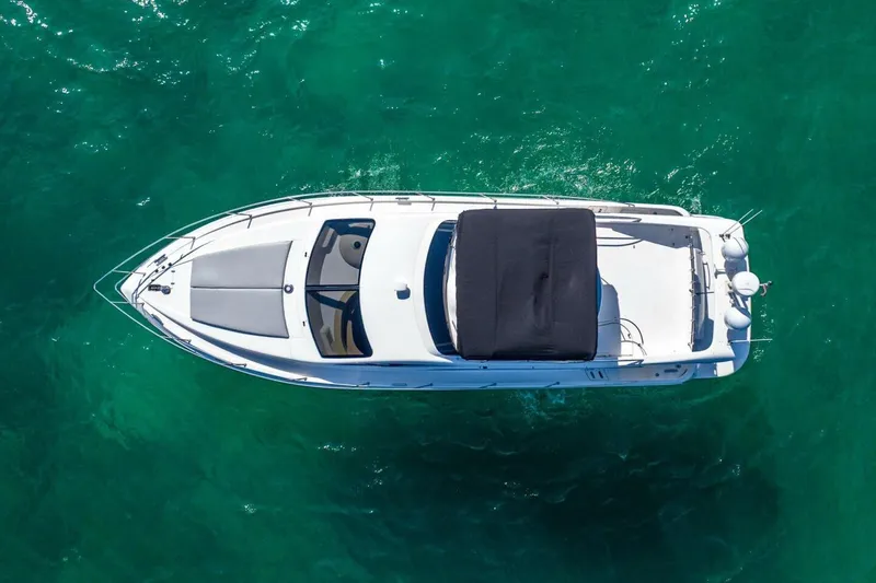  Yacht Photos Pics Aerial view of 2001 Azimut 46 yacht on clear turquoise water.