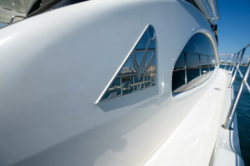  Yacht Photos Pics 2001 Azimut 46 yacht, sleek design with logo, docked by the water.