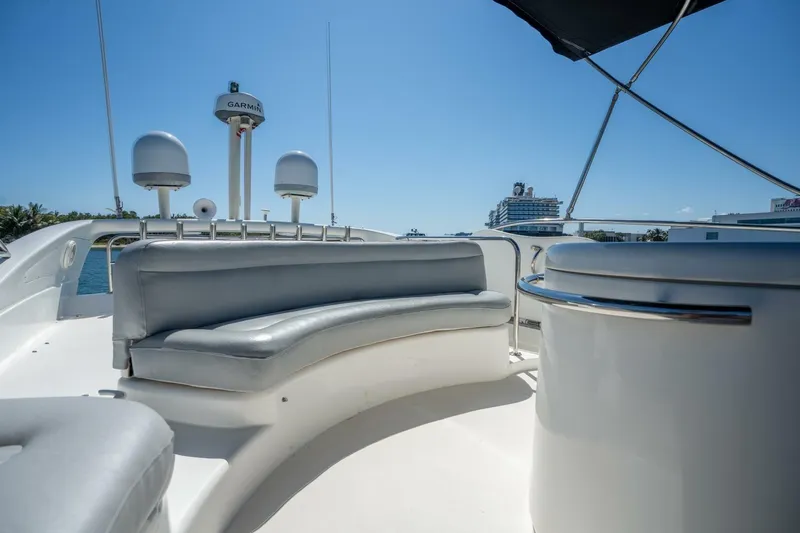  Yacht Photos Pics 2001 Azimut 46 yacht deck with seating and navigation equipment under clear blue sky.