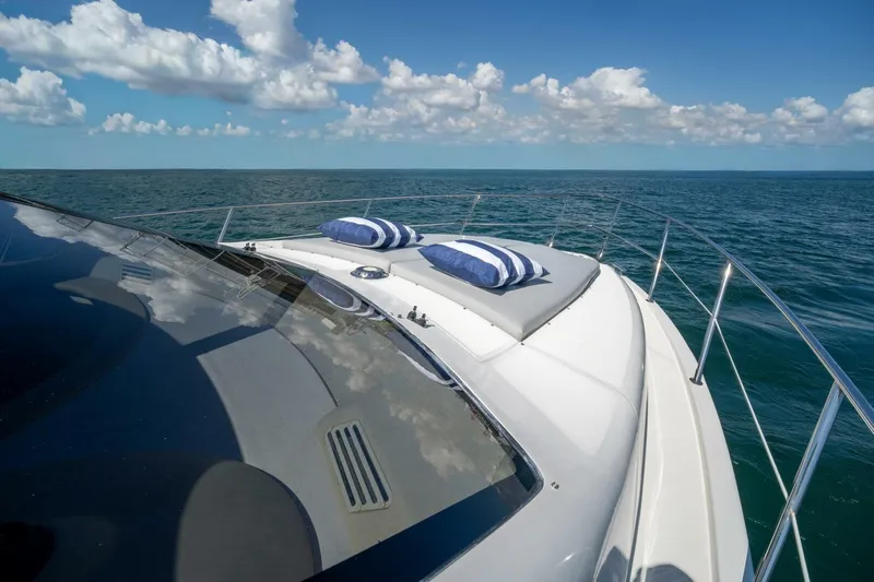  Yacht Photos Pics 2001 Azimut 46 yacht deck with cushions, ocean view, and blue sky.