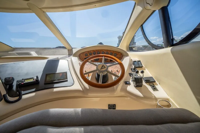  Yacht Photos Pics Cockpit of 2001 Azimut 46 yacht with steering wheel and navigation controls.