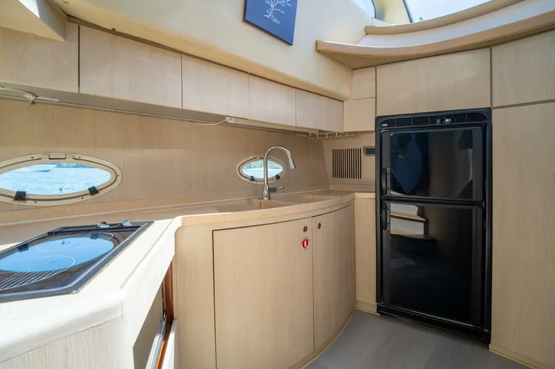  Yacht Photos Pics Luxurious kitchen interior of 2001 Azimut 46 yacht with modern appliances.
