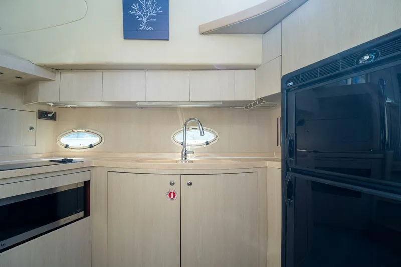  Yacht Photos Pics 2001 Azimut 46 yacht kitchen with modern appliances and sleek cabinetry.