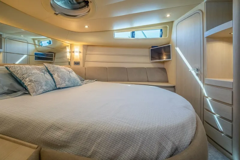  Yacht Photos Pics Luxurious interior of 2001 Azimut 46 yacht with cozy bed and modern decor.