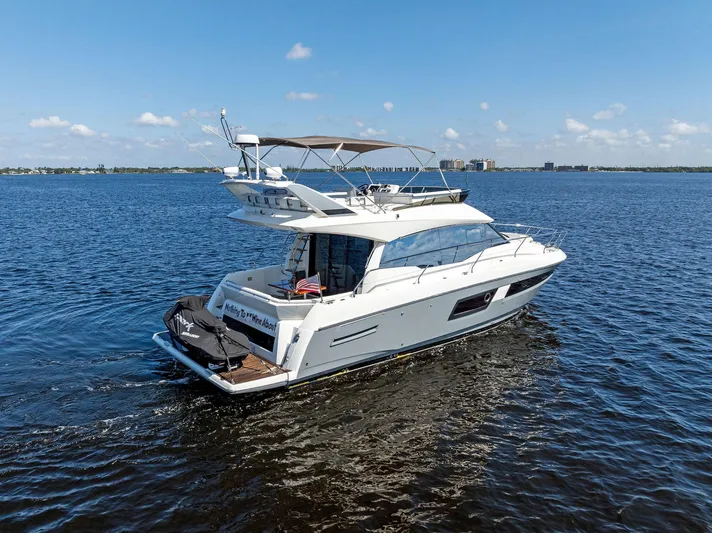  Yacht Photos Pics 2018 Prestige 460 yacht cruising on open water under clear blue sky.