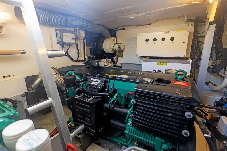  Yacht Photos Pics Engine room of a 2018 Prestige 460 yacht with visible machinery and components.