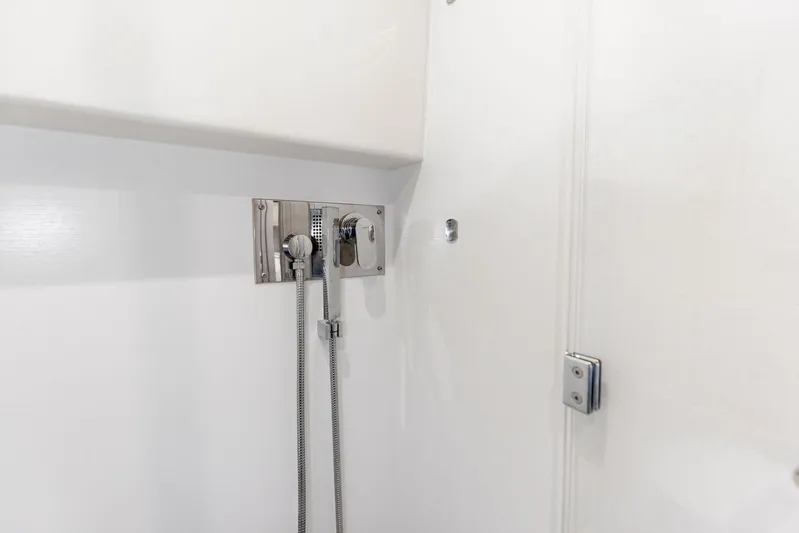  Yacht Photos Pics Shower area in 2018 Prestige 460 yacht with chrome fixtures.