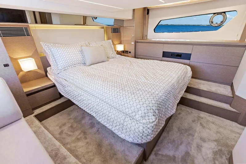  Yacht Photos Pics Luxurious bedroom interior of 2018 Prestige 460 yacht with ocean view.