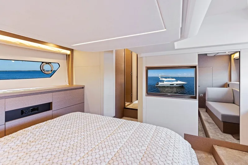  Yacht Photos Pics Luxurious bedroom interior of 2018 Prestige 460 yacht with ocean view.