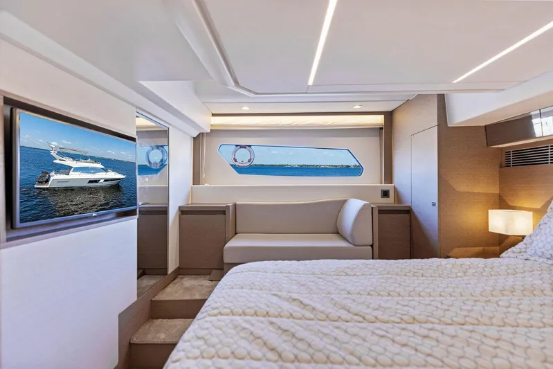  Yacht Photos Pics Luxurious bedroom interior of 2018 Prestige 460 yacht with ocean view and modern amenities.