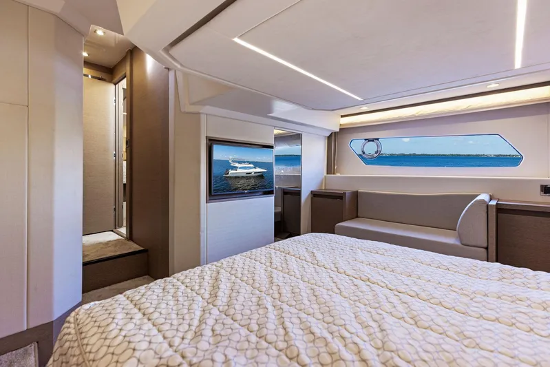  Yacht Photos Pics Luxurious bedroom interior of 2018 Prestige 460 yacht with ocean view.