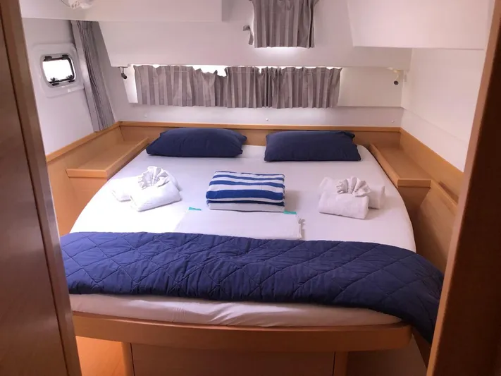 Darwin Yacht Photos Pics Lagoon 42 2020 model bedroom with cozy bedding and natural light.