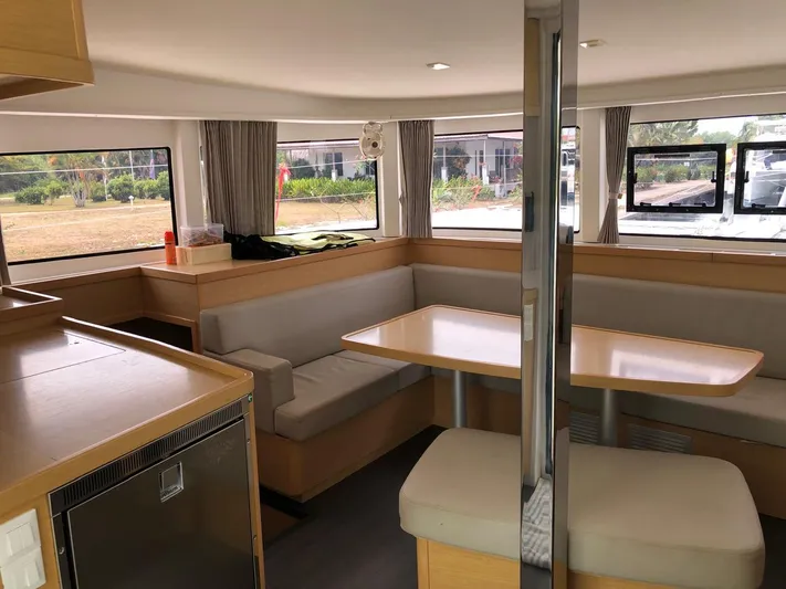Darwin Yacht Photos Pics Interior of 2020 Lagoon 42 catamaran with dining area and large windows.