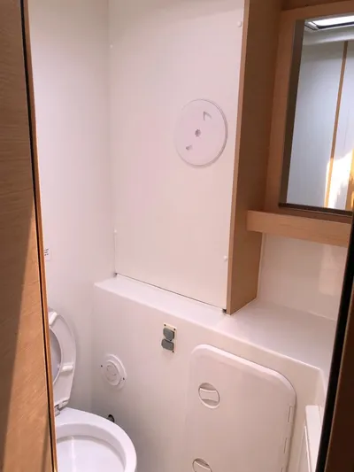 Darwin Yacht Photos Pics 2020 Lagoon 42 yacht bathroom with modern fixtures and wooden accents.