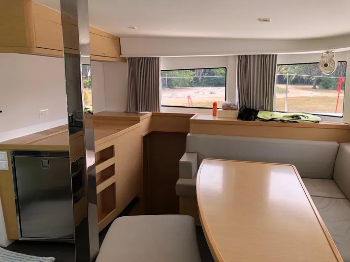 Darwin Yacht Photos Pics Interior of 2020 Lagoon 42 catamaran with modern kitchen and dining area.