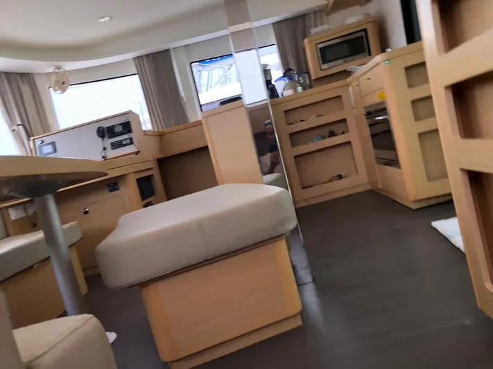 Darwin Yacht Photos Pics Interior of 2020 Lagoon 42 catamaran with modern furnishings and ample natural light.