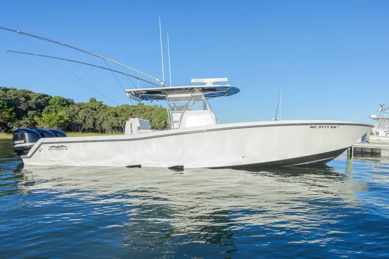  Yacht Photos Pics 2015 Invincible 39 Open Fisherman boat on calm water, side view.
