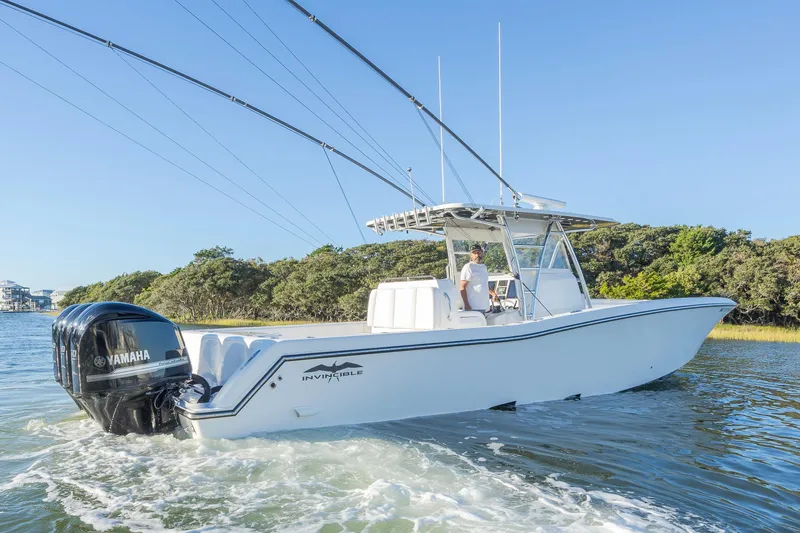  Yacht Photos Pics 2015 Invincible 39 Open Fisherman boat cruising on a sunny day.