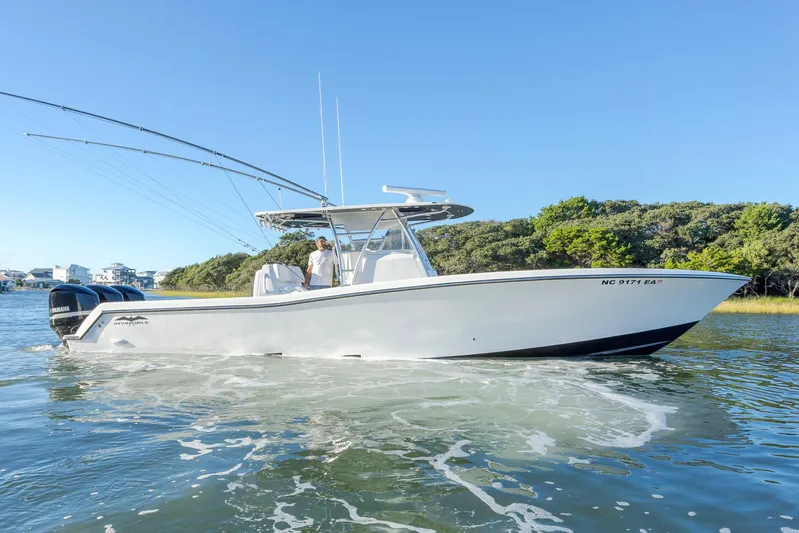  Yacht Photos Pics 2015 Invincible 39 Open Fisherman boat cruising on a sunny day.