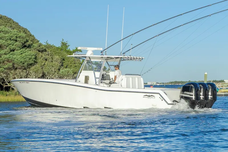  Yacht Photos Pics 2015 Invincible 39 Open Fisherman boat cruising on a sunny day.