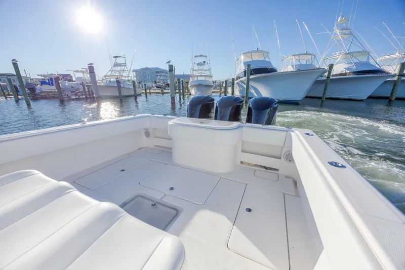  Yacht Photos Pics 2015 Invincible 39 Open Fisherman boat docked in sunny marina.