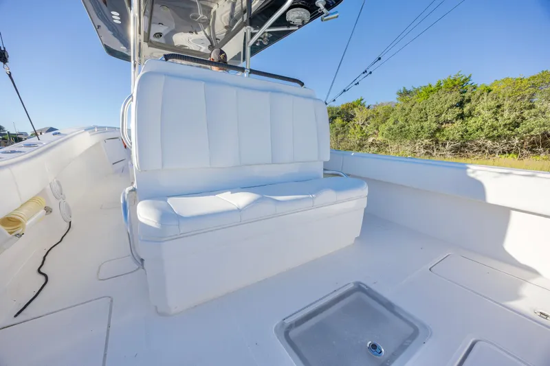  Yacht Photos Pics 2015 Invincible 39 Open Fisherman boat interior with white seating and clear blue sky.