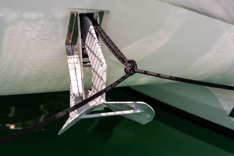  Yacht Photos Pics Anchor of 2023 Fountaine Pajot Isla 40 catamaran, secured with black rope.