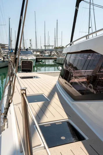  Yacht Photos Pics 2023 Fountaine Pajot Isla 40 catamaran docked in a marina, showcasing sleek deck design.