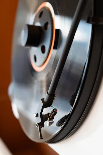  Yacht Photos Pics Close-up of a vinyl record player needle on a spinning record.