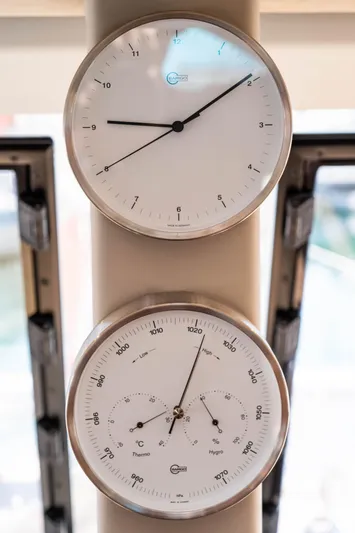  Yacht Photos Pics Analog clock and barometer on Fountaine Pajot Isla 40, 2023 model yacht interior.