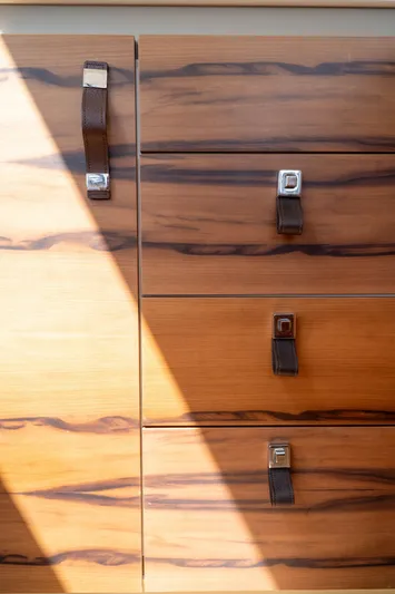  Yacht Photos Pics Wooden cabinet with leather handles on a 2023 Fountaine Pajot Isla 40 yacht.