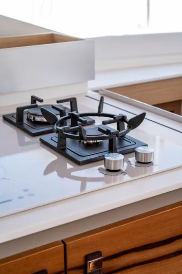  Yacht Photos Pics Modern kitchen stove on 2023 Fountaine Pajot Isla 40 catamaran, featuring sleek design and controls.