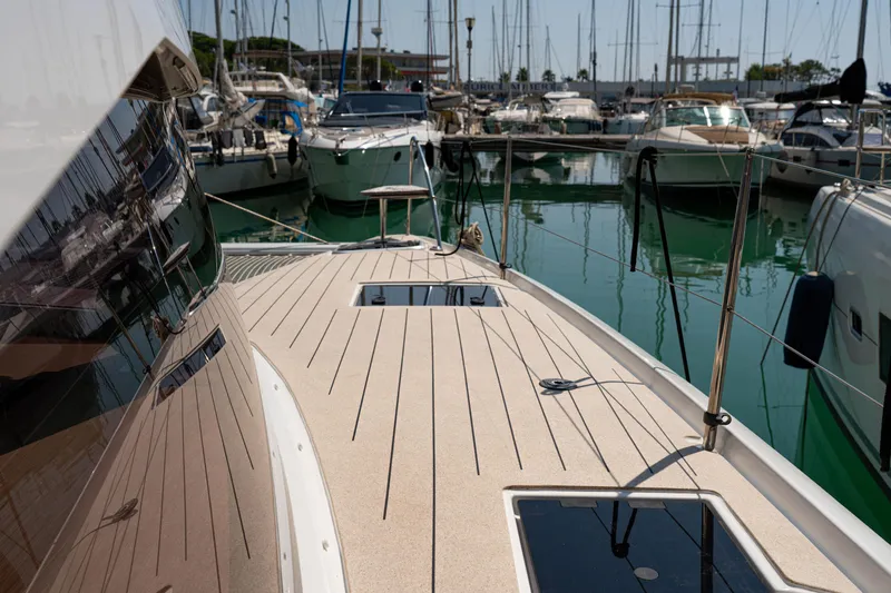  Yacht Photos Pics 2023 Fountaine Pajot Isla 40 catamaran docked in a marina, showcasing sleek deck design.