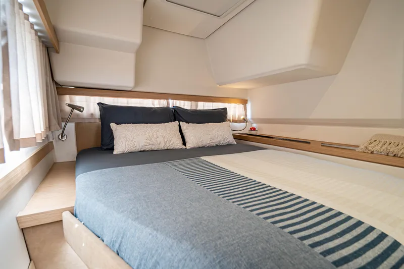  Yacht Photos Pics 2023 Fountaine Pajot Isla 40 cabin interior with cozy bedding and modern design.