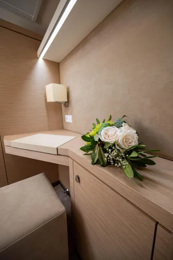  Yacht Photos Pics Interior of 2023 Fountaine Pajot Isla 40 with elegant decor and floral arrangement.