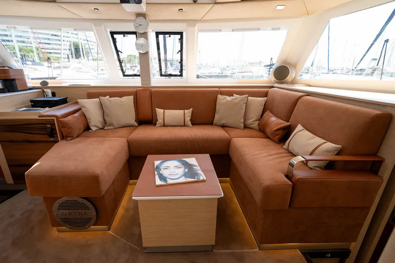  Yacht Photos Pics Luxurious interior of 2023 Fountaine Pajot Isla 40 catamaran with plush seating and elegant decor.