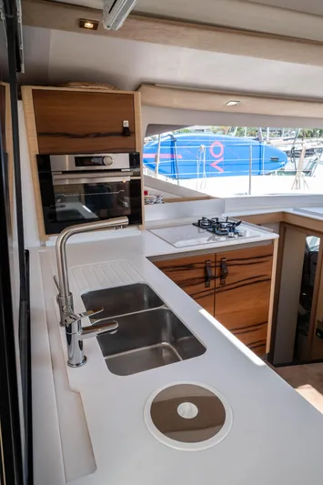  Yacht Photos Pics Modern kitchen interior of 2023 Fountaine Pajot Isla 40 catamaran with sleek design.