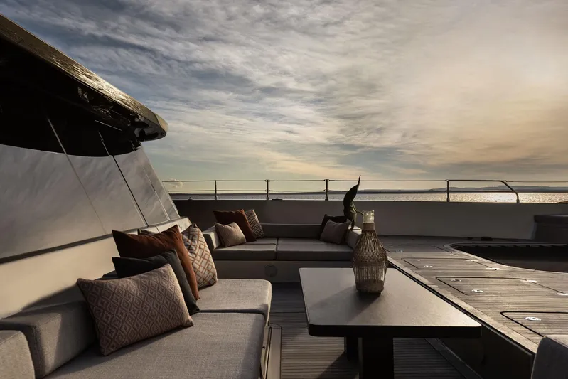 Otoctone Yacht Photos Pics Luxurious Sunreef 80 sailing yacht deck with elegant seating, 2024 model, at sunset.