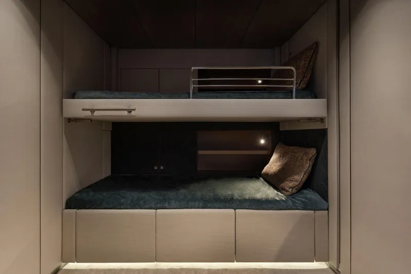 Otoctone Yacht Photos Pics 2024 Sunreef 80 Sailing yacht interior with modern bunk beds and cozy lighting.