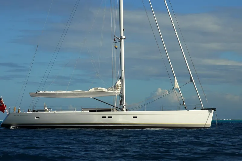 Whimsy Yacht Photos Pics Sailing yacht Vaudrey Miller 78, 2005 model, cruising on open sea under clear skies.