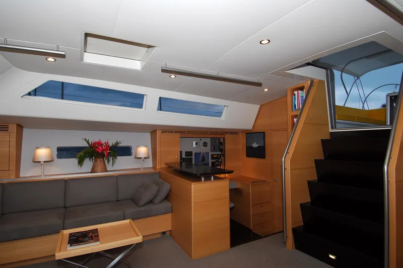 Whimsy Yacht Photos Pics Luxurious interior of 2005 Vaudrey Miller 78 yacht with modern design and comfortable seating.