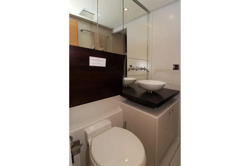 Whimsy Yacht Photos Pics Modern bathroom in 2005 Vaudrey Miller 78 yacht with dual vessel sinks.