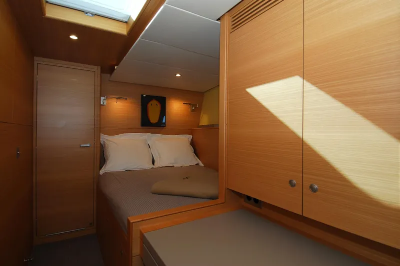 Whimsy Yacht Photos Pics Luxurious Vaudrey Miller 78 yacht bedroom interior, featuring wood paneling and cozy bedding, 2005 model.