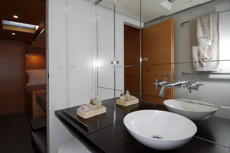 Whimsy Yacht Photos Pics Luxurious bathroom in 2005 Vaudrey Miller 78 yacht with modern fixtures and elegant design.