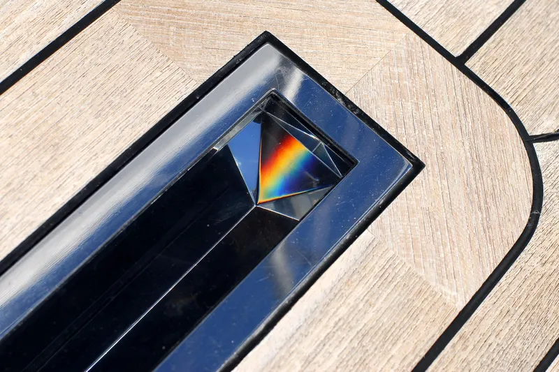 Whimsy Yacht Photos Pics Wooden deck with a prism creating a rainbow reflection, Vaudrey Miller 78, 2005 model.