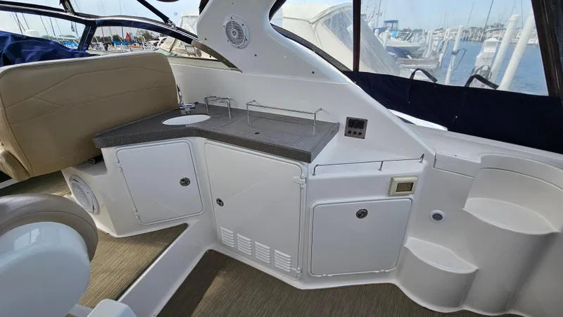  Yacht Photos Pics Interior view of 2007 Regal 3760 Commodore yacht with kitchenette and seating area.