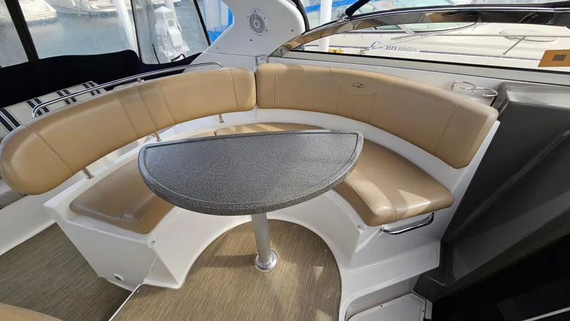  Yacht Photos Pics 2007 Regal 3760 Commodore boat interior with tan seating and a small table.