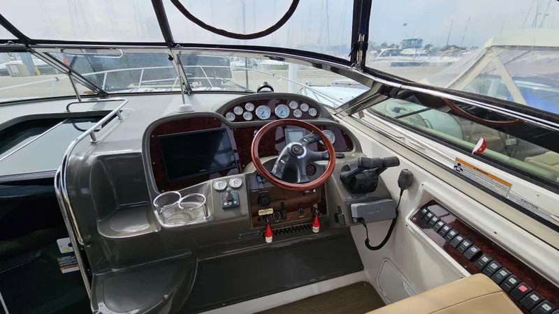  Yacht Photos Pics 2007 Regal 3760 Commodore boat cockpit with steering wheel and control panel.